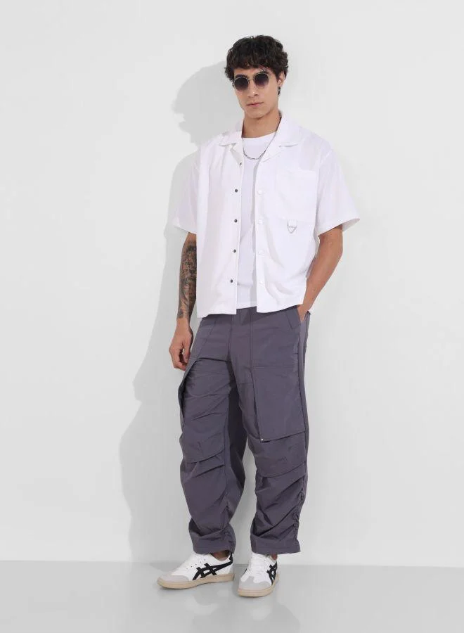 The Indian Garage Co Men Baggy Fit Solid Cross Pocket Mid-Rise Trousers